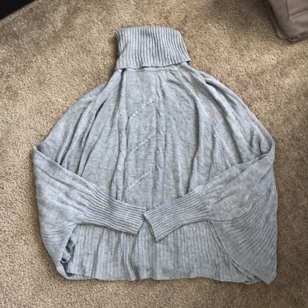 Grey poncho.